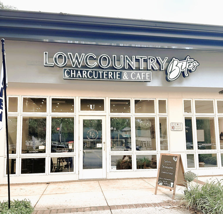 Lowcountry Bites Charcuterie & Cafe storefront with sign and windows.